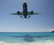 Aeroplane flying over beach